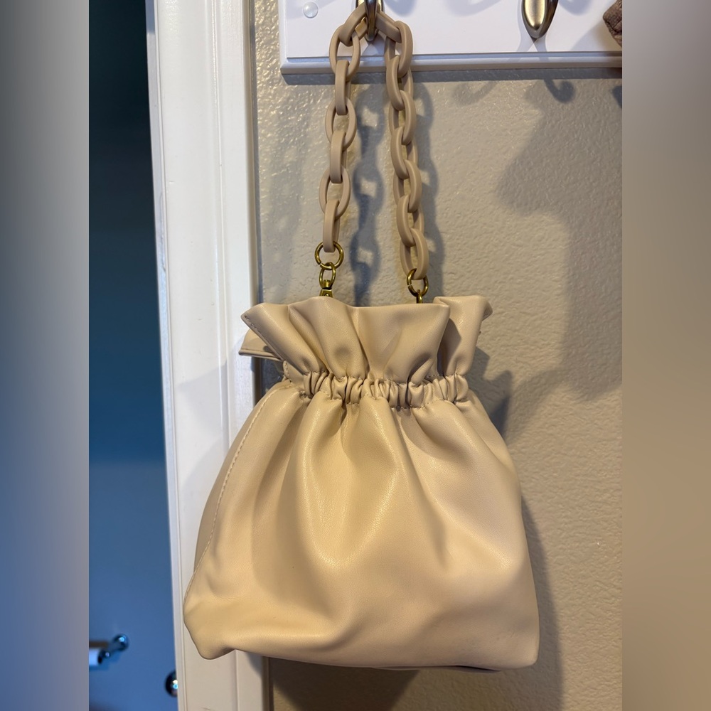 Leather “pouch” handbag